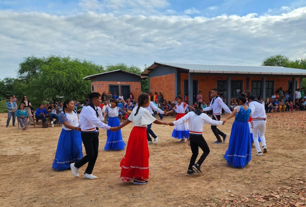 A group of kids joyfully dancing outdoors