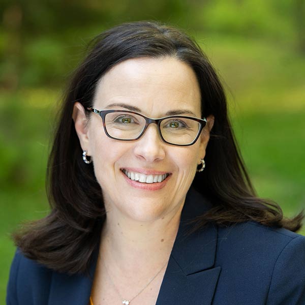 a headshot of a woman smiling at camera