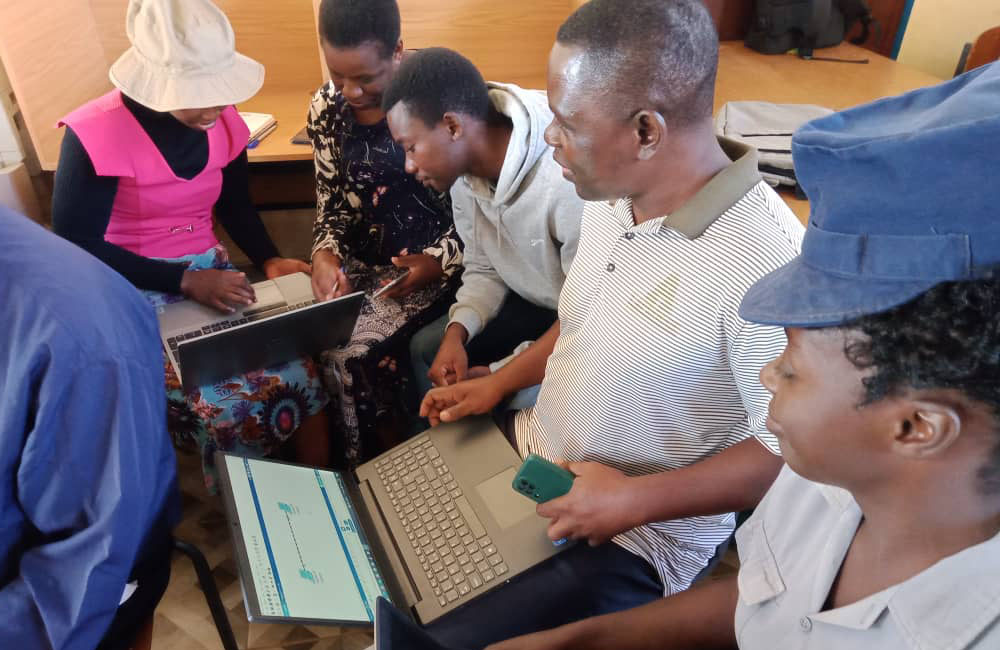 A group of people sitting with computers