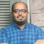 a man in a blue pattern shirt 