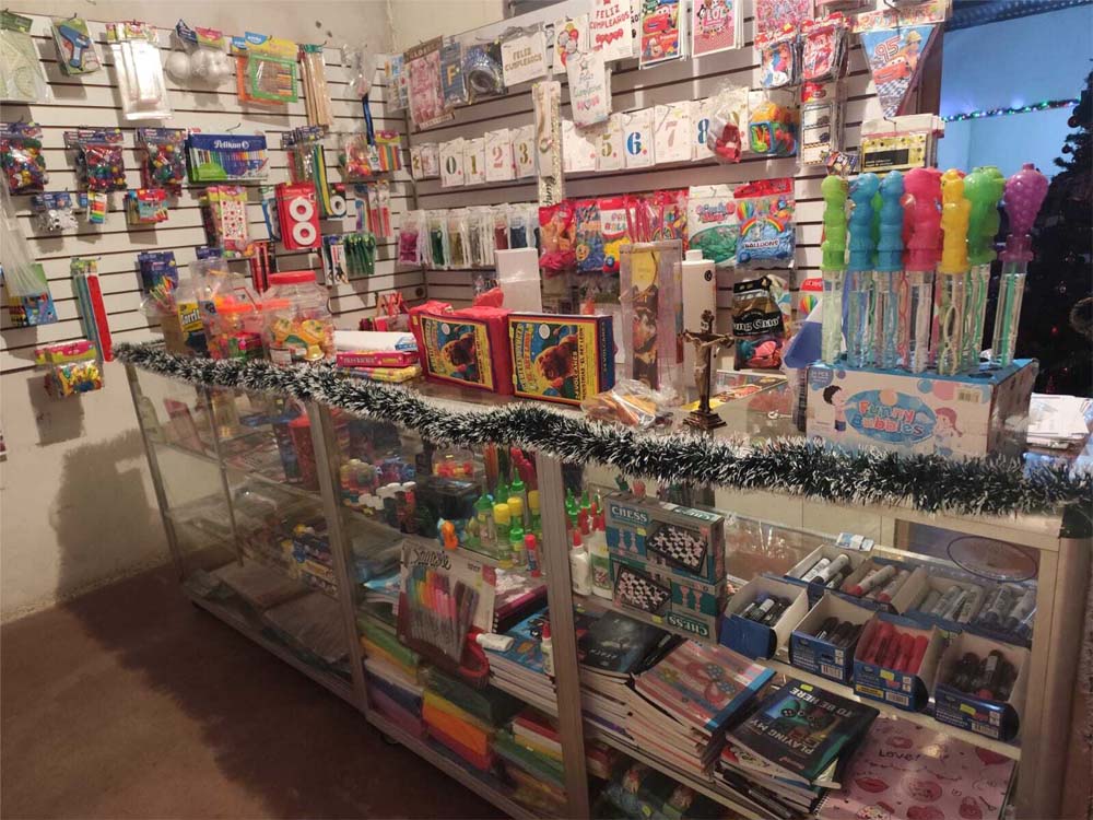 A small shop selling school supplies inside a community center