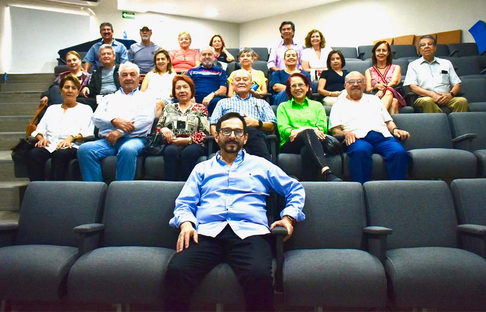 Jeffry Fernandez sits with a class of older adults.